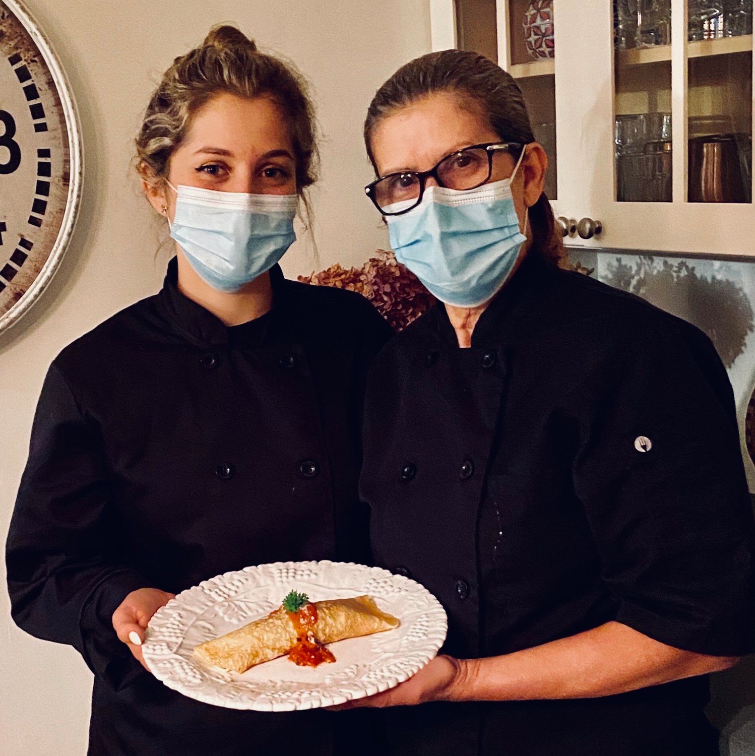 Sullivan West senior Jessica Schwalb, left, and chef Soraia Haberli with one of their crêpes.